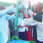 Secretary to the Rivers State Government, Hon Magnus Abe (left) who represented the state governor, presenting a trophy to the winning team captain of the Ministry of Commerce, winners of football competition organised by the Head of Service to mark the 2009 Civil Service Week, at Liberation Stadium, Elekahia, Port Harcourt, yesterday