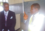 Chairman, Board of  Directors of the Federal Airports Authority of Nigeria (FAAN), Chief Ebitimi Banigo (left) listening to an explanation by the Regional Manager of Port Harcourt International Airport, Omagwa, Mr Uche Nwanguma, when the FAAN board visited the airport, recently.