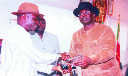 jun290902 Bayelsa State Governor, Chief Timipre Sylva (right) presenting a souvenir to Senator Biargha Amange, leader of Senate Committee on Petroleum, during the committees visit to Government House, Yenagoa, recently. Photo: Chris Monyanaga