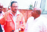 Senator Simon Ajibolo (right), member senate Committee On Petroleum, listening to Engr Chris Descat, Superintendents Obite Gas Plant, during a facility inspection by senate committee