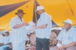 jul2409bus17 Rivers State Governor, Rt. Hon. Chibuike Amaechi (middle) recieving an address from the the state chairman of Nigerian Labour Congress, Comrade Chris Oruge while the state Deputy Governor Engr.Tele Ikuru, watches with interest during a Workers Day celebration in Port Harcourt. Photo: King Osila