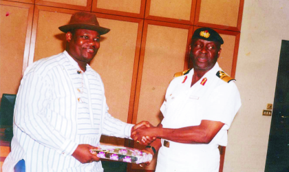 jul270902 Rivers State Deputy Governor, Engr Tele Ikuru (left) presenting a souvenir to Rear Admiral Dele Ezeoba, chairman, Inter-Agency Maritime Security Task Force, when he led members of the task force on a courtesy visit to Government House, Port Harcourt, recently
