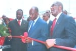 Rivers State Governor, Rt Hon Chibuike Rotimi Amaechi (middle) cutting the tape to commission the Aso Savings and Loans office in Port Harcourt, while Mr Collins Chikeluba, director and Mr Hassan  Usman, managing director of Port Harcourt branch watch.