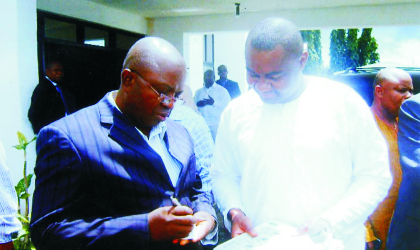 Secretary to the Rivers State Government, Hon Magnus Abe (right) comparing notes with the director of Finance and Administration of NDDC, Pastor Godspower Aginiga,  at the Port Harcourt International Airport, Omagwa, recently. Photo Ike Wigodo