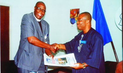 General Manager, Rivers State Newspaper Corporation, Mr Celestine Ogolo (right)  presenting copies of The Tide to the chairman, Manufacturers Association of Nigerian, Rivers/Bayelsa branch, Rev Bekwelem F. Wabara, when the manufacturers paid  the corporation a courtesy visit, last Monday.  Photo; Egberi Sampson
