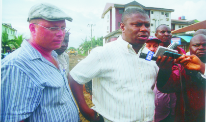 Rivers State Commissioner for Works, Hon Dakuku Peterside (right) speaking to newsmen shortly after flagging -off government roads repair initiative, “Zero Tolerance for Pot Holes” at Rmuolumeni and Ada-George Road, yesterday, while project Manager, Reynolds Construction Company, Mr Andry Suslovic (left) listens