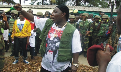 Leader of the Niger Delta Vigilante Force (NDVF), Ateke Tom (centre) speaking during his surrender of weapons at Port Harcourt Tourist Beach, Saturday.