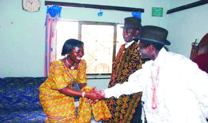 Wife of Bayelsa State Governor, Mrs Alanyingi Sylva (left) being welcome to the palce of the Amayanowei, Odi  by HRM  King Mozi Agara Ibiyanowei of Kolokuma clan while King Shine Apre, Amanyanowei of Odi (middle) , listens during a courtesy visit.