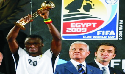 Ghana's Dominic Adiyiah raises the trophy of the U-20 World Cup at the Cairo International Stadium, Cairo, yesterday. Ghana beat Brazil 4-3 in penalties after the match finished 0-0.