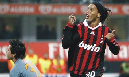 oct210903 AC Milian’s Ronaldinho (right) celebrating his penalty goal against Roma at the weekend. He will lead the Rossoneris against the Merengues today.