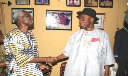 Chairman of Rivers State Scholarship Board, Capt Elechi Amadi (left) in a warm handshake with Governor Rotimi Amaechi, last week.