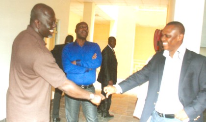 Governor  Chibuike Rotimi Amaechi (centre) watches while Hon Olaka Nwogu, member, House of Representatives (right) and Engr Thompson Wakama (left), MD, Drex Nig Ltd, builders of the new Maxilo-facial hospital, Port Harcourt exchange greetings.