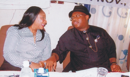nov130903 Rivers State Commissioner for Health, Dr Sampson Parker (right) in a chat with the chairman, House Committee on Health, Mrs Irene Inimgba during the official flag off of the new state strategic plan for 2010-2015, yesterday