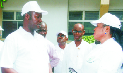 Chairman, Rivers State chapter of Nigeria Union of Journalists (NUJ), Mr Opaka Dokubo (left) listening to General Manager of Radio Rivers, Ms Medline Tador during the NUJ press week procession in Port Harcourt, last Friday.  Photo: Chris Monyanaga.