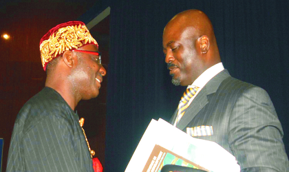 Author of the book, “Participation in Petroleum Development, Towards Sustainable Development In The Niger Delta”, Aseme-Alabo Edward T. Bristol-Alagbariya (left) being congratulated by the chairman, governing council, Maritime Academy of Nigeria (MAN) and Chief Launcher at the book presentation, Chief Dumo Lulu-Briggs, shortly after the book presentation at the Congress Main Hall, Transcorp Hilton, Abuja, last Thursday.