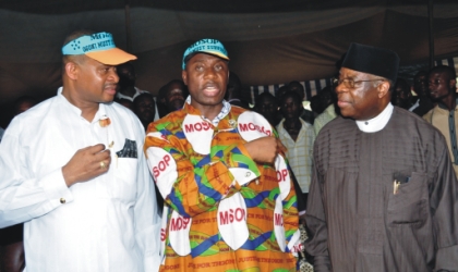 jan061001 Rivers State Governor, Chibuike Rotimi Amaechi (centre) discussing with Chief Ufot Ekatte Minister of Niger Delta Ministry (right) and Senator Lee Meeba at 2010 Ogoni day celebration at Bori, on Monday.