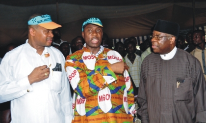 Rivers State Governor, Chibuike Rotimi Amaechi (centre) discussing with Chief Ufot Ekatte Minister of Niger Delta Ministry (right) and Senator Lee Meeba at 2010 Ogoni day celebration at Bori, on Monday.