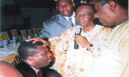 jan081003 Vice Chairman, Pentecostal Fellowship of Nigeria , South-South, Dr Omobude, praying for Rivers State PFN chairman, Apostle Zilly Aggrey, during the inauguration of Rivers PFN executive council members, on Tuesday.