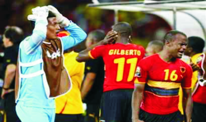 Angola’s Flavio (right) and teammate Angola’s Alegre Wilson (left), react at the end of play after their African Cup of Nations Group A soccer match against Mali ended 4-4 at the November 11 stadium in Luanda, Angola, yesterday.