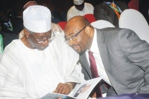 Member, Board of Trustees, Peoples Democratic Party, Chief Tony Anenih (left), going through a programme with the Permanent Representative, International Maritime Organisation, Mr William Azuh, at the 2nd Ministerial Conference on Port control and  10th anniversary celebration of the Abuja MoU, in Abuja,  yesterday.