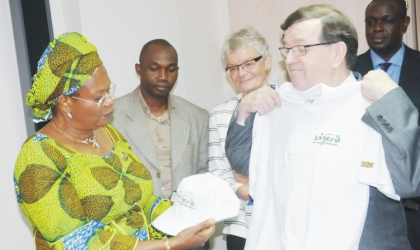 17031001 Minister of Information and Communications, Prof. Dora Akunyili (left), presenting Nigerian Re-branding sourvenirs to the Finish Minister of Foreign Trade and Development, Mr Paavo Vayrynen at a bilateral meeting in Abuja, Monday.