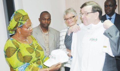 Minister of Information and Communications, Prof. Dora Akunyili (left), presenting Nigerian Re-branding sourvenirs to the Finish Minister of Foreign Trade and Development, Mr Paavo Vayrynen at a bilateral meeting in Abuja, Monday.