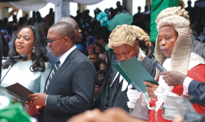 19031001 Anambra State Governor, Peter Obi (2nd left) being administering Oath of Office by the state Chief Judge , Justice Paul Obidigwe (right), in Awka on Wednesday. With him is his wife, Margaret. Photo: NAN