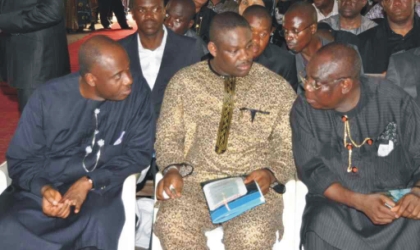 Rivers State Governor, Rt. Hon Chibuike Rotimi Amaechi (left) conferring with his Deputy, Engr. Tele Ikuru (centre) and Chief A. J. Turner at the burial  of late Hon. Moses Elemchi Ahubele, Rivers State Commissioner for Employment Generation and Empowerment,  at Abarikpo, Ahoada-East Local Government Area, yesterday.