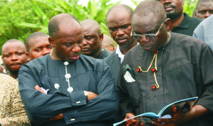 22031001 Representative of Nigeria’s Acting President, Chief J.Turner (right) and Rivers State Governor, Rt Hon Chibuike Rotimi Amaechi, perusing a document, at the funeral service in honour of late Rivers State Commissioner for Employment Generation and Empowerment, Hon Moses Ahubele, at St Barnabas Anglican Church, Abarikpo, Rivers State, last Saturday