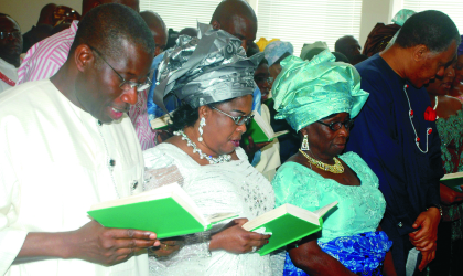 05041001 Acting President, Dr Goodluck Jonathan, his wife, Patience, mother, Eunice and former Minister of State for Petroleum, Mr Odein Ajumogobia, during Easter Church Service at the Villa Chapel in Abuja, yesterday.