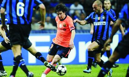 Barca’s Lionel Messi (middle) being denied space by Inter players yesterday at the San Siro