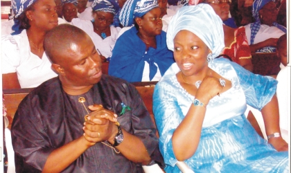 11061003 Wife of Rivers State Governor, Dame Judith Amaechi (right) conferring with Commissioner for Works, Engr Dakuku Peterside, during the church service of Mrs Boma Nseigbe at St Thomas Anglican Church, Diobu, Port Harcourt, recently. Photo: Obinna Dele Prince.
