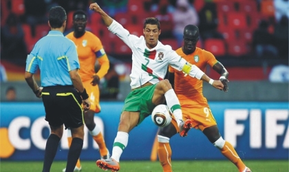 Ronaldo (7) being matched by Ivorian players, yesterday