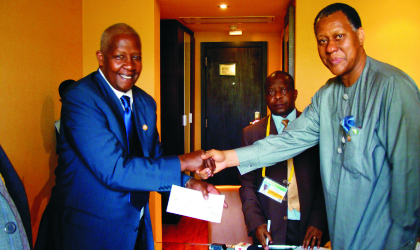 Foreign Affairs Minister, Mr Odein Ajumogobia (right), presenting a cheque of $200,000 (N30 million) to his Ugandan counterpart, Mr Sam Kuteesa, as Nigerian Government’s donation to the victims of Bududa landslide in Uganda, yesterday.