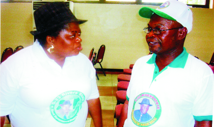 Chairman, G-23 Support for Jonathan 2011, Mr Charles Okaye (right) conferring with Hon Emily Solomon, Treasurer, during the state rally conducted by the team at Hotel Presidential, Port Harcourt, Monday