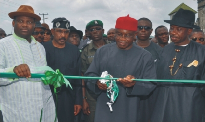 Senate President David Mark (middle) cutting the tape to commission Okrika Ring Road in Rivers State .With him are  Governor  Chibuike Rotimi Amaechi of Rivers State (right),  Senator  Olorunmbe Mamora (2nd left) and Engr. Tele Ikuru, Deputy Governor of Rivers State.