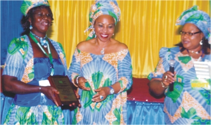 FRED291003 General Manager, External Relations, Nigeria Liquefied Natural Gas (NLNG),Siene Allwell-Brown (middle), Head, Economic Empowerment of the company, Emily Green-Nwodim (right) and Mrs Mojiba Harry, a beneficiary during NLNG’s Economic Empowerment Development Day held in Port Harcourt, last Wednesday.