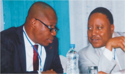 Rivers State Commissioner for Economic Planning, Hon. Charles Gogo (left) conferring with his Finance counterpart, Hon George Feyii, during a two-day South-South zonal Dialogue and Policy sensitisation workshop, organised by United Nations Development Programme and Nigeria Governors’ Forum at Hotel Presidential, Port Harcourt, on Tuesday. Photo: Chris Monyanaga