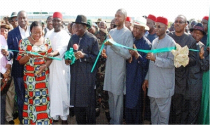 FRED20121002 President Goodluck Jonathan (middle) cutting the tape to inaugurate Akanu Ibiam Airport runway in Enugu last Friday. With him (from left) are Sen. Ayogu Eze, Minister of Aviation, Mrs. Fidelia Njeze, Deputy Senate President, Ike Ekweremadu, and (from right are) Governors Ikedi Ohakim of Imo, Peter Obi of Anambra, Martin Elechi of Ebonyi and Sullivan Chime of Enugu states.
