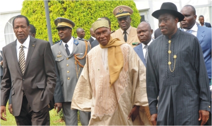 FRED27121002 L-R: President Blaise Compaore of Burkina Faso, President Abdulahi Wade of Senegal and President Goodluck Jonathan arriving for an Economic Community of West African States (ECOWAS) Summit On Cote D’Ivoire, in Abuja last Friday.