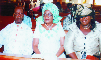 FRED31121003 Former Rivers State Deputy Governor, Sir Gabriel Toby with wife, Christy (middle), and State Commissioner for Information and Communications, Mrs Ibim Semenitari, during a special family thanksgiving service in honour of his wife at St. Nicholas (Anglican) Church, Woji, Tuesday. Photo: Chris Monyanaga