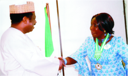 Minister of State for Health, Alhaji Suleiman Bello, in a handshake with Lion Dame Joy Warmate during a courtesy visit of the Lions Club International District 404A to the minister in Abuja, recently.