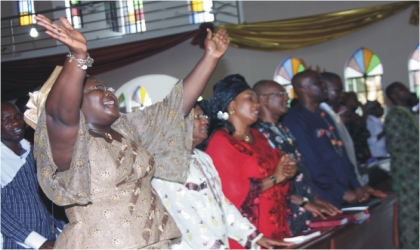 Commissioner of Information and Communications, Mrs Ibim Semenitari, praising God during the thanksgiving/re-dedication service of the ministry, held at St. Nicholas (Ang) Church, Woji Deanery, last Sunday.