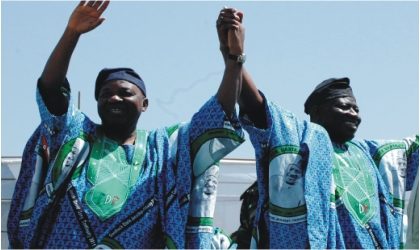 FRED18021103 President Goodluck Jonathan (right) and Vice President Namadi Sambo, acknowledging cheers in Jos during the PDP presidential campaign, yesterday