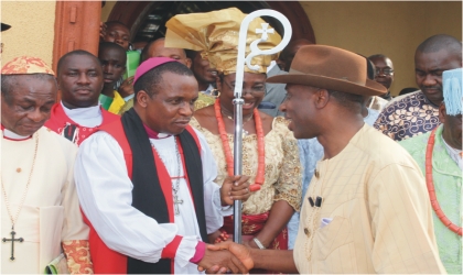 FRED21021101 Rivers State Governor, Rt Hon Chibuike Rotimi Amaechi (right) being welcomed by Bishop Solomon Gbaregbara at a special Thanksgiving service by the Supreme Council of Traditional Rulers of Ogoni held in Bori.