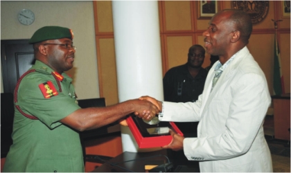 Rivers State Governor, Rt Hon Chibuike Rotimi Amaechi (right) receiving a souvenir from Lt Gen Onyeabo Azubuike Ihejirika, Chief of Army Staff ,during a courtesy visit to Government House, Port Harcourt, yesterday.
