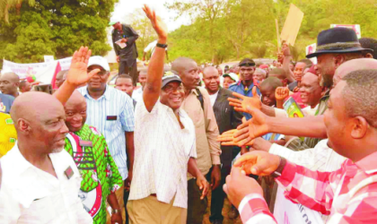 Senate President, David Mark (middle), acknowledging cheers from his supporters during a campaign in Ogbadibo Local Government Area  of Benue State, recently.