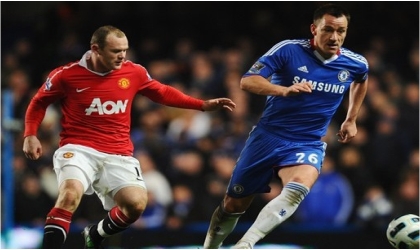 Man Utd’s Wayne Rooney (left) putting pressure on Chelsea’s skipper, John Terry in a previous  encounter.