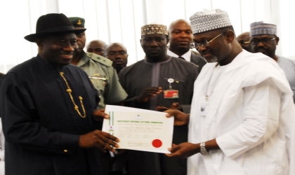 The_Tide_Wednesday Front President-elect, President Goodluck Jonathan (left), receive his Certificate of Return from Independent National Electoral Commission (INEC) Chairman, Prof. Attahiru Jega in Abuja, yesterday.