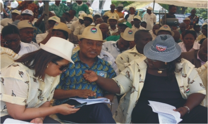 FRED04051101 From Right: Rivers State Commissioner for Information and Communications, Mrs Ibim Semenitari, chatting with her Finance and Water Resources counterparts, Hon George Feyii and Ms Patricia Simon-Hart, during the Workers Day celebration in Port Harcourt, last Sunday.